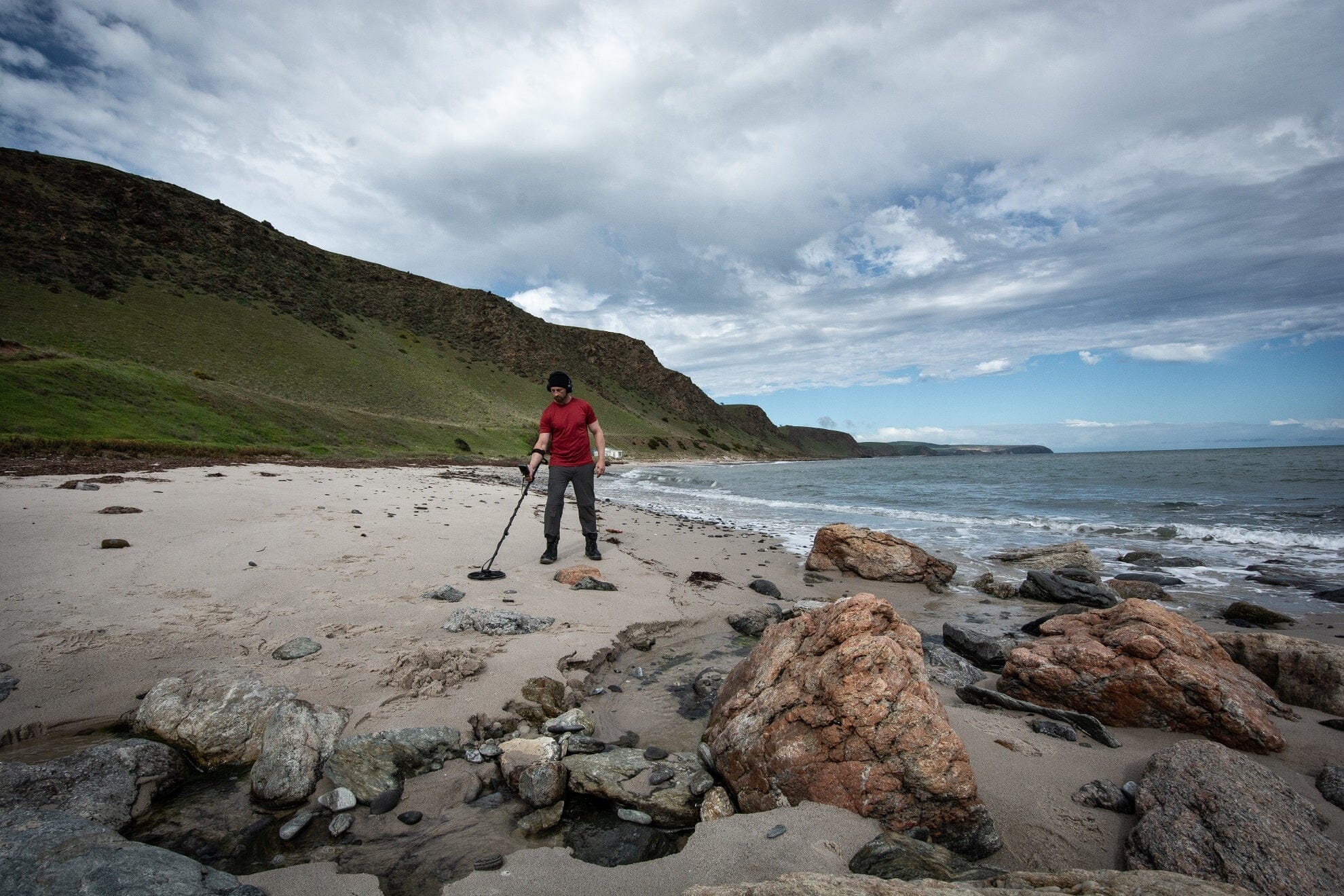 Equinox 900 metal detector in use on the beach