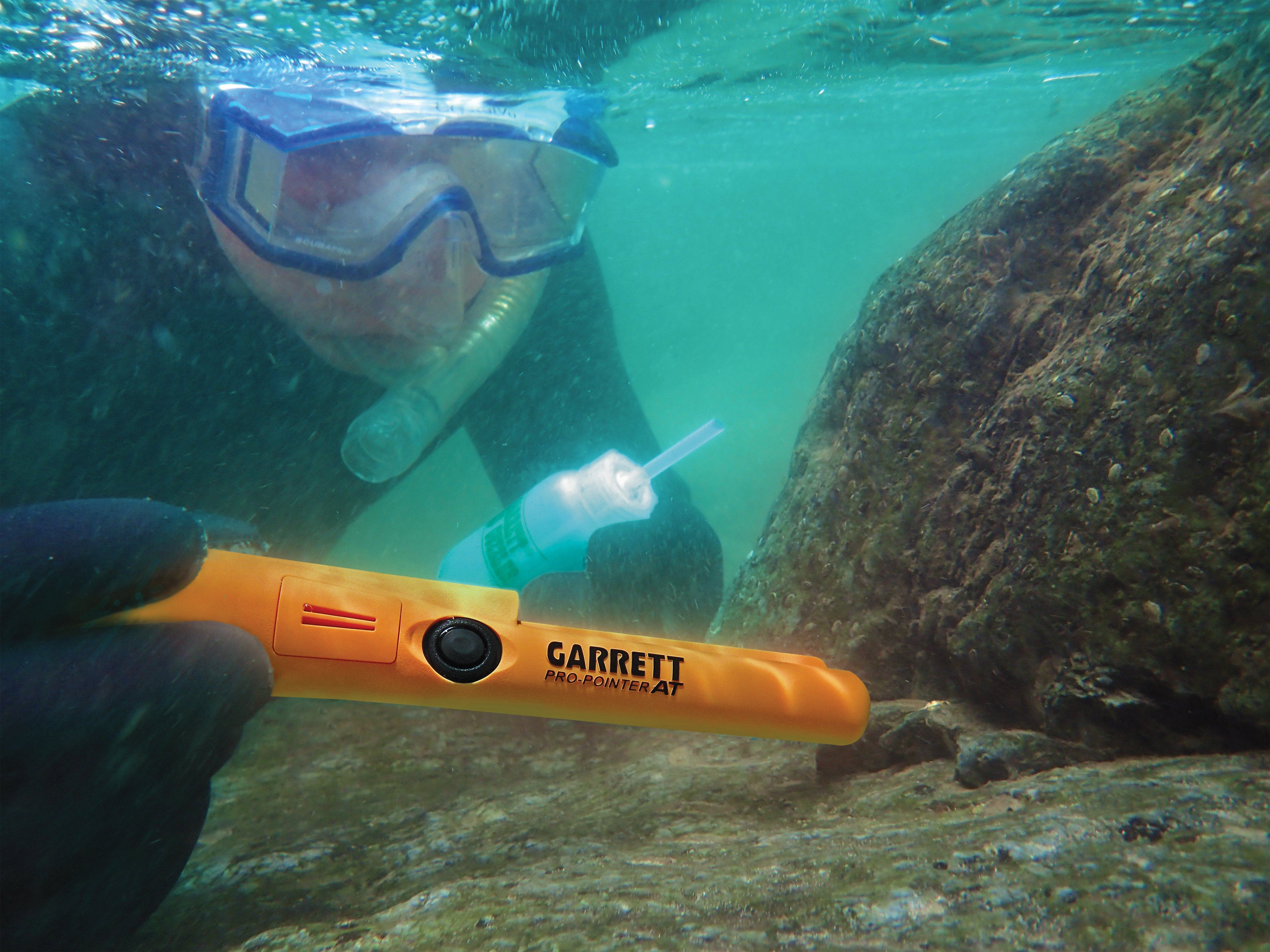 Garrett Pro Pointer AT pinpointer submerged with snorkeler finding gold underwater