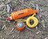 5-IN-1 Orange Survival Whistle With Lanyard on ground lifestyle image