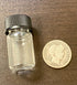 half ounce gold vial with barber dime for scale